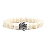 Margarida - Pulseira com estampa de patas decorada com miçangas.