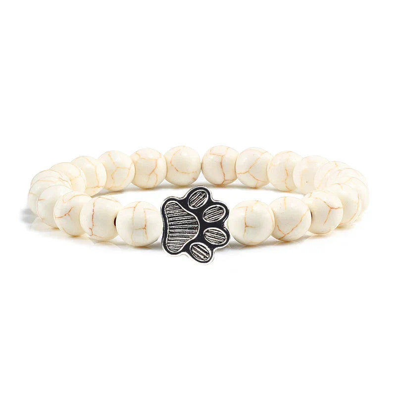 Margarida - Pulseira com estampa de patas decorada com miçangas.