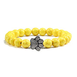 Margarida - Pulseira com estampa de patas decorada com miçangas.