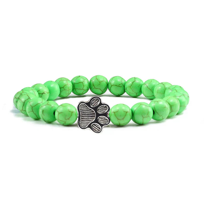 Margarida - Pulseira com estampa de patas decorada com miçangas.